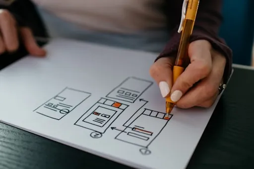 Designer sketching wireframe screens
