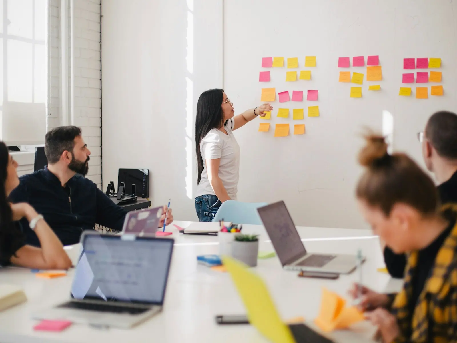 Workshop with sticky notes and laptops